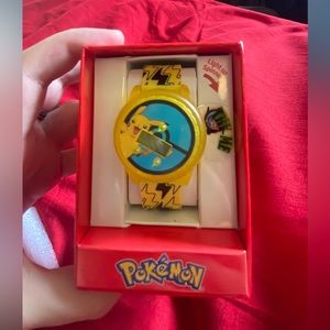 Brand new Kids Pokémon spinning light up watch